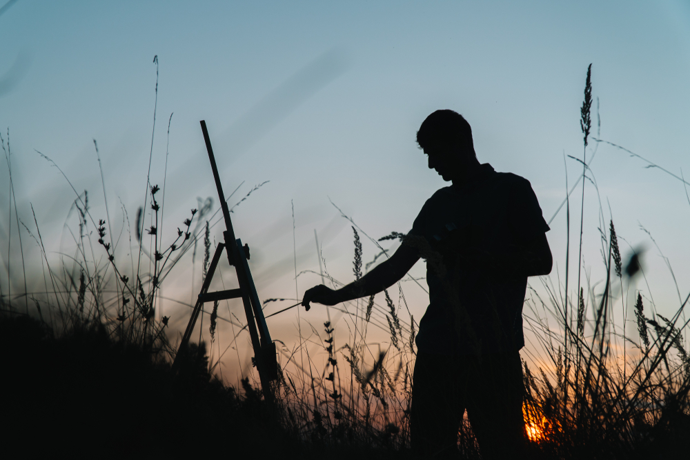 Image of a painter in a field