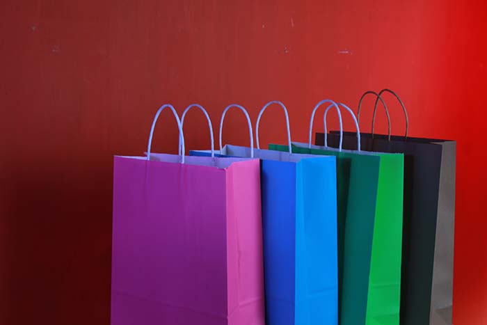 Image of shopping bags lined up.